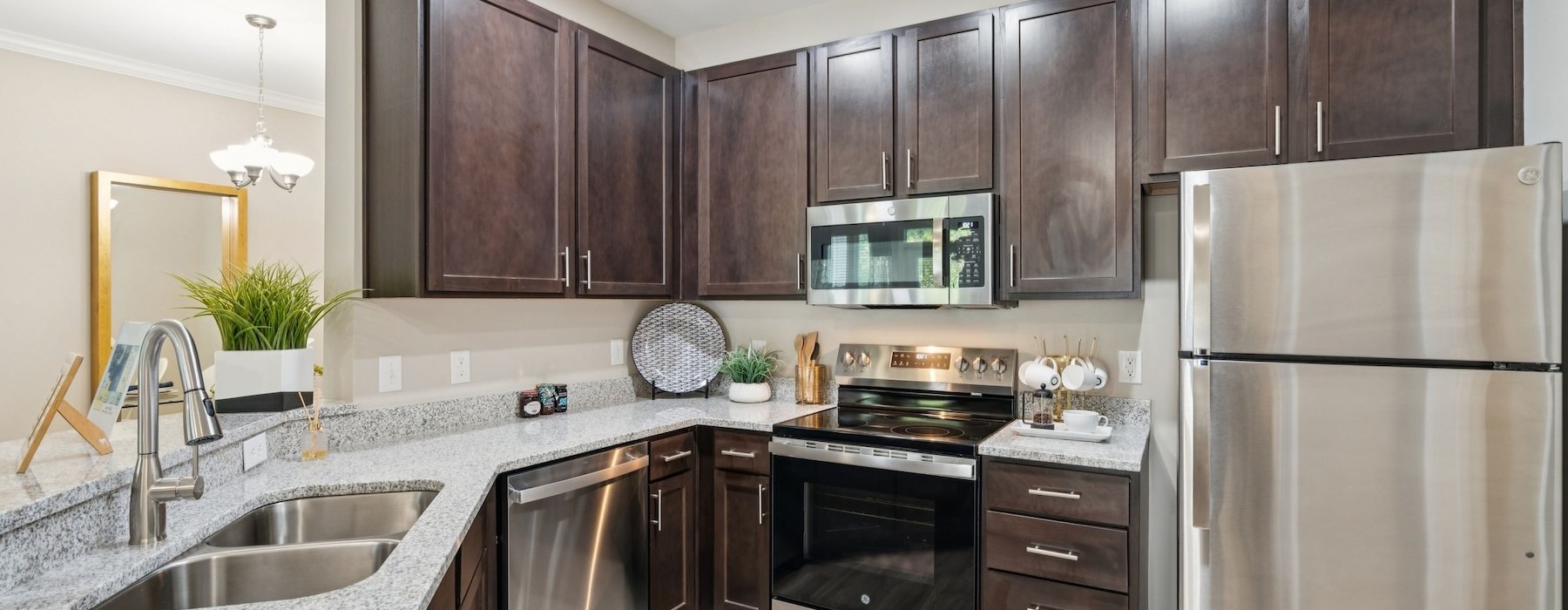 a kitchen with dark cabinets