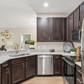 a kitchen with wooden cabinets